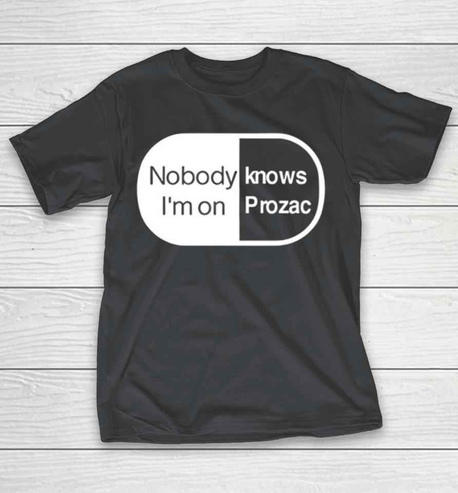 Robbie Williams wearing noboydy I'm on knows prozac Shirts